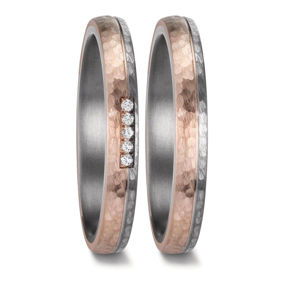 "Matching wedding ring set crafted from tantalum and 14K rose gold, featuring a hammered and brushed finish. The men's ring showcases a sleek design with two-thirds matte-finish rose gold and one-third brushed tantalum, separated by a finely engraved line. The women's ring mirrors this elegant contrast and is adorned with five pavé-set diamonds, adding a touch of brilliance to the refined, modern design