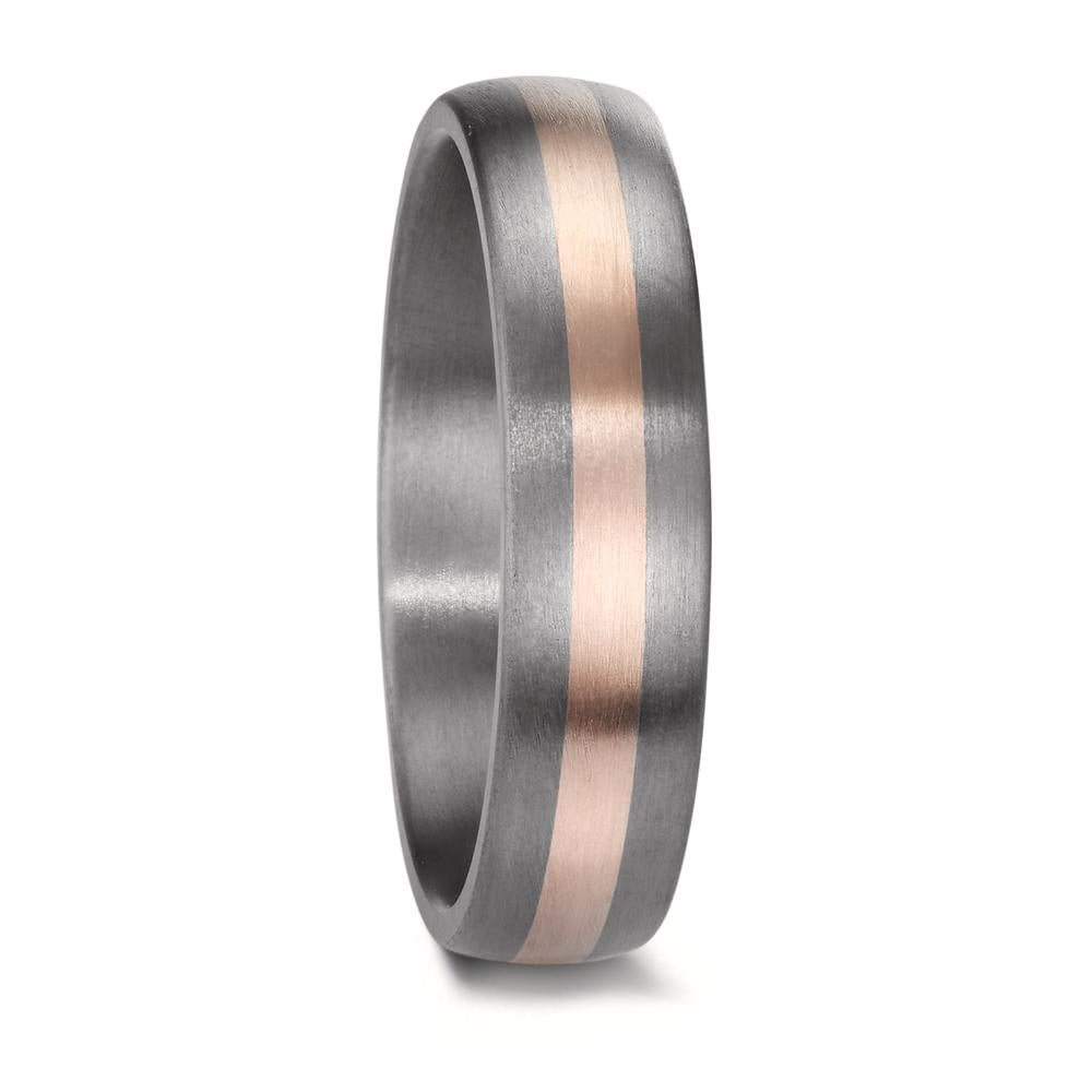 A matching wedding ring set crafted from tantalum and rose gold. The men's ring features a sleek, modern design with a central rose gold inlay, while the women's ring is adorned with three sparkling diamonds, complementing the warm rose gold accent set into the rich, dark tantalum