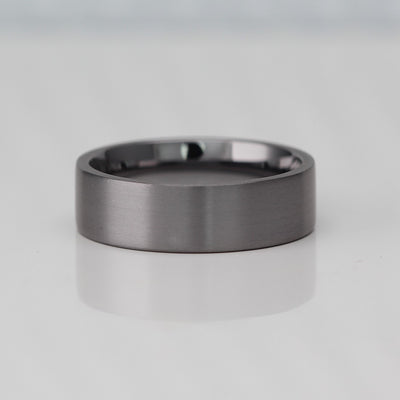 Flat court wedding ring band in brushed tantalum 7mm wide with a comfort fit inside
