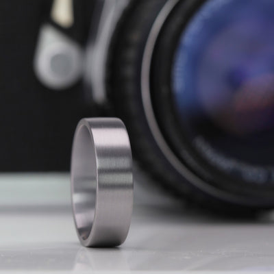 Tantalum wedding ring band for man or woman. It is a modern,  Flat court profile shape in dark blue grey alternative metal